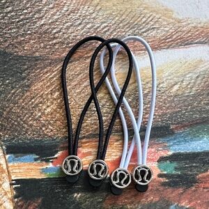 Lululemon Black and White Hair Ties or zipper pull